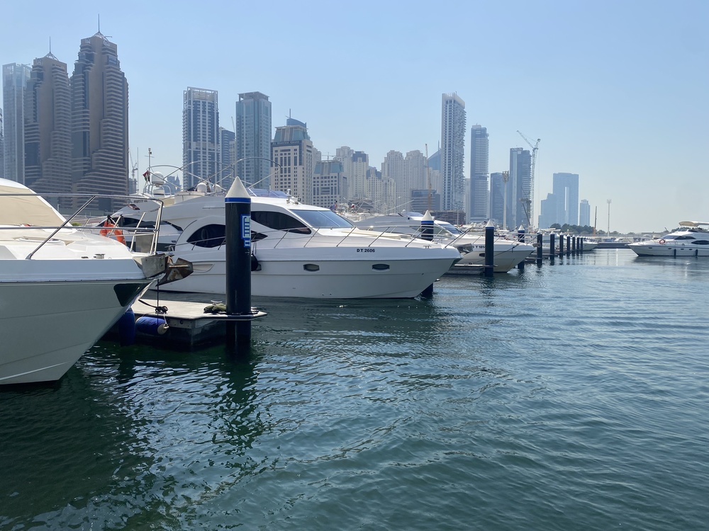 Luxury yachts lined up at Dubai Marina before a private yacht ride with YRD Yachts